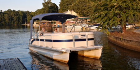 Motor-Boatin' Pontoon boat pulling in to the dock.